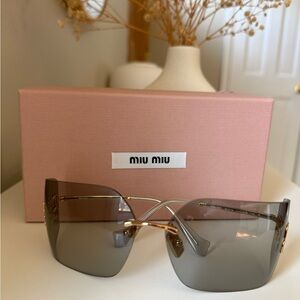 Miu Miu Black and Gold Sunglasses